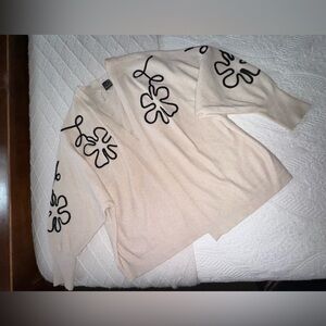 Chic Cream Cardigan with Black Floral Accents